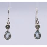 A pair of silver drop earrings. 2 cm high.