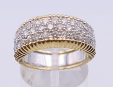 An 18 ct white and yellow gold 1 carat diamond bombe ring. Ring size N/O. 9.2 grammes total weight.