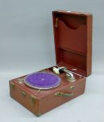 A vintage portable gramophone. 43 cm long.