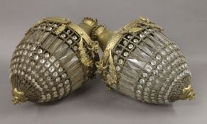 A pair of cut glass and brass chandeliers of pineapple form. Approximately 50 cm high.