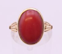 A 14 K gold coral ring. Ring size N/O.
