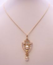 A 9 ct gold pearl pendant on an Edwardian 9 ct gold chain. The pendant 4 cm high. 4.