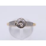 An 18 ct gold 0.5 carat diamond solitaire ring. Ring size Q. 4 grammes total weight.