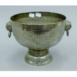 A niello decorated Siamese unmarked white metal pedestal bowl with dog-of-fo mask handles.