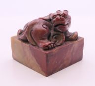 A Chinese soapstone dog-of-fo seal. 5 cm high.