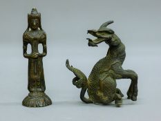 A small antique Eastern bronze figure of a standing Buddha and an antique Chinese bronze depicting