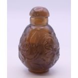 A Chinese hardstone carved snuff bottle. 8 cm high.