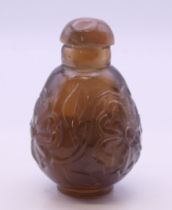 A Chinese hardstone carved snuff bottle. 8 cm high.