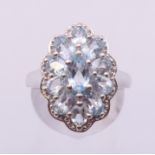 A silver aquamarine cluster ring. Ring size O/P.