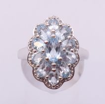 A silver aquamarine cluster ring. Ring size O/P.