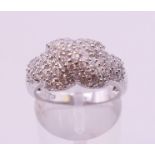A silver cubic zirconia crossover ring. Ring size O/P.