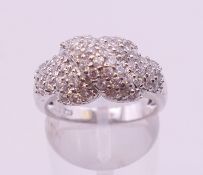 A silver cubic zirconia crossover ring. Ring size O/P.