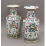 A large pair of 19th century Chinese porcelain Canton vases painted with figures, etc. 43 cm high.
