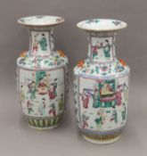 A large pair of 19th century Chinese porcelain Canton vases painted with figures, etc. 43 cm high.