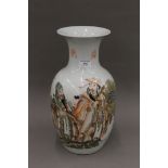 A mid-20th century Chinese porcelain vase painted with three dignitaries and two rows of