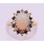A 14 K gold opal and diamond ring. Ring size L/M.