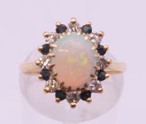 A 14 K gold opal and diamond ring. Ring size L/M.