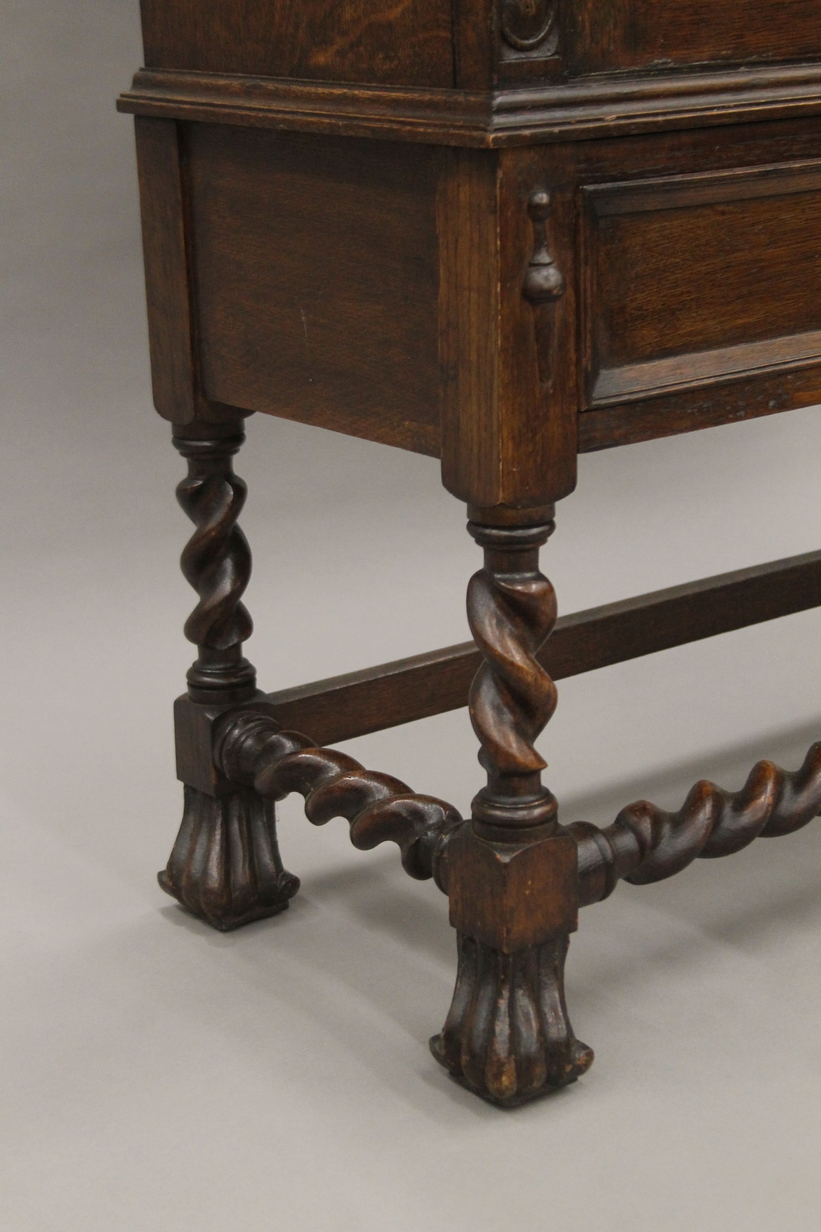 An early 20th century carved oak two door glazed barley twist cabinet. 105 cm wide. - Image 5 of 5