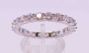 A silver and cubic zirconia full eternity ring. Ring size U.
