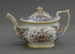 A 19th century ceramic teapot, underside indistinctly inscribed Worcester. 26.5 cm long.