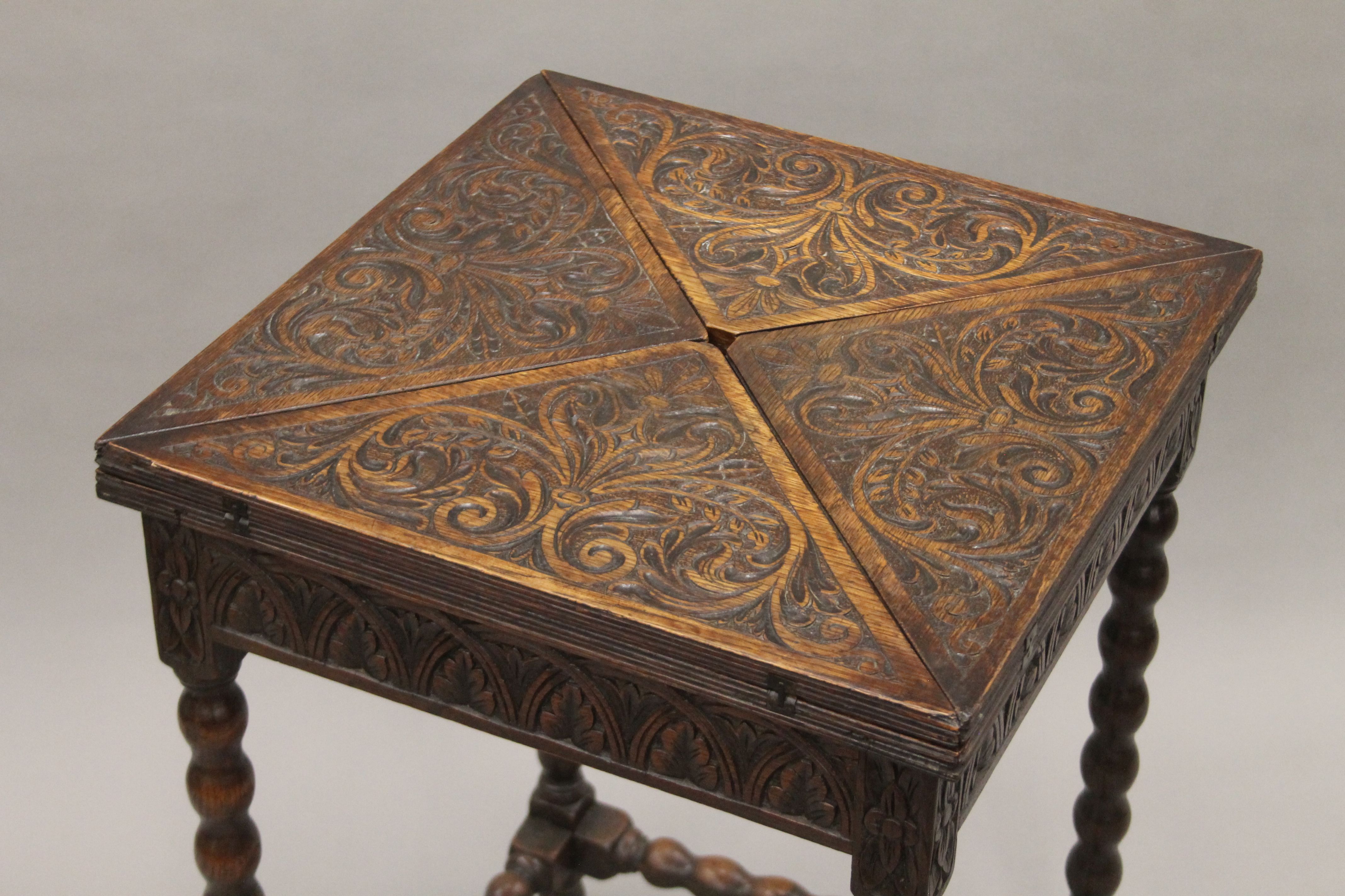 A Victorian carved oak envelope card table. 48.5 cm wide. - Image 2 of 4