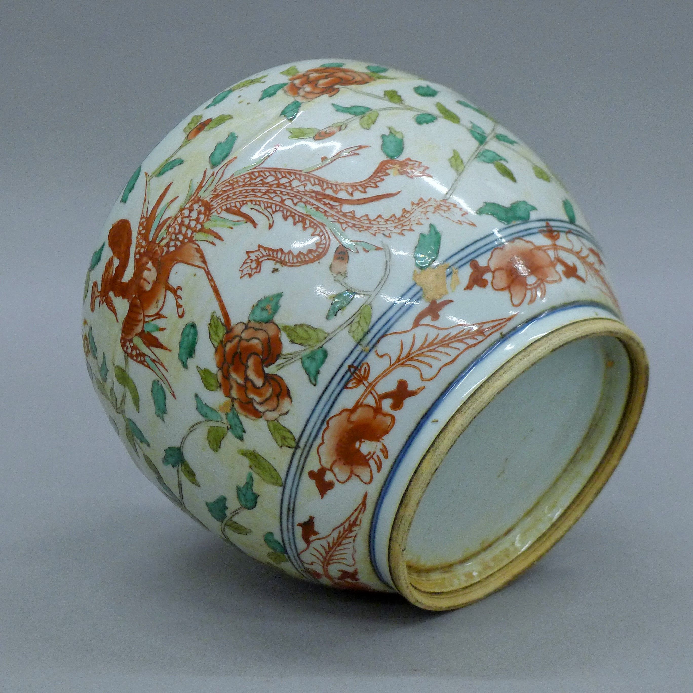 A 20th century Chinese Wucai enamelled ginger jar depicting a pair of phoenixes amongst a floral - Image 7 of 7