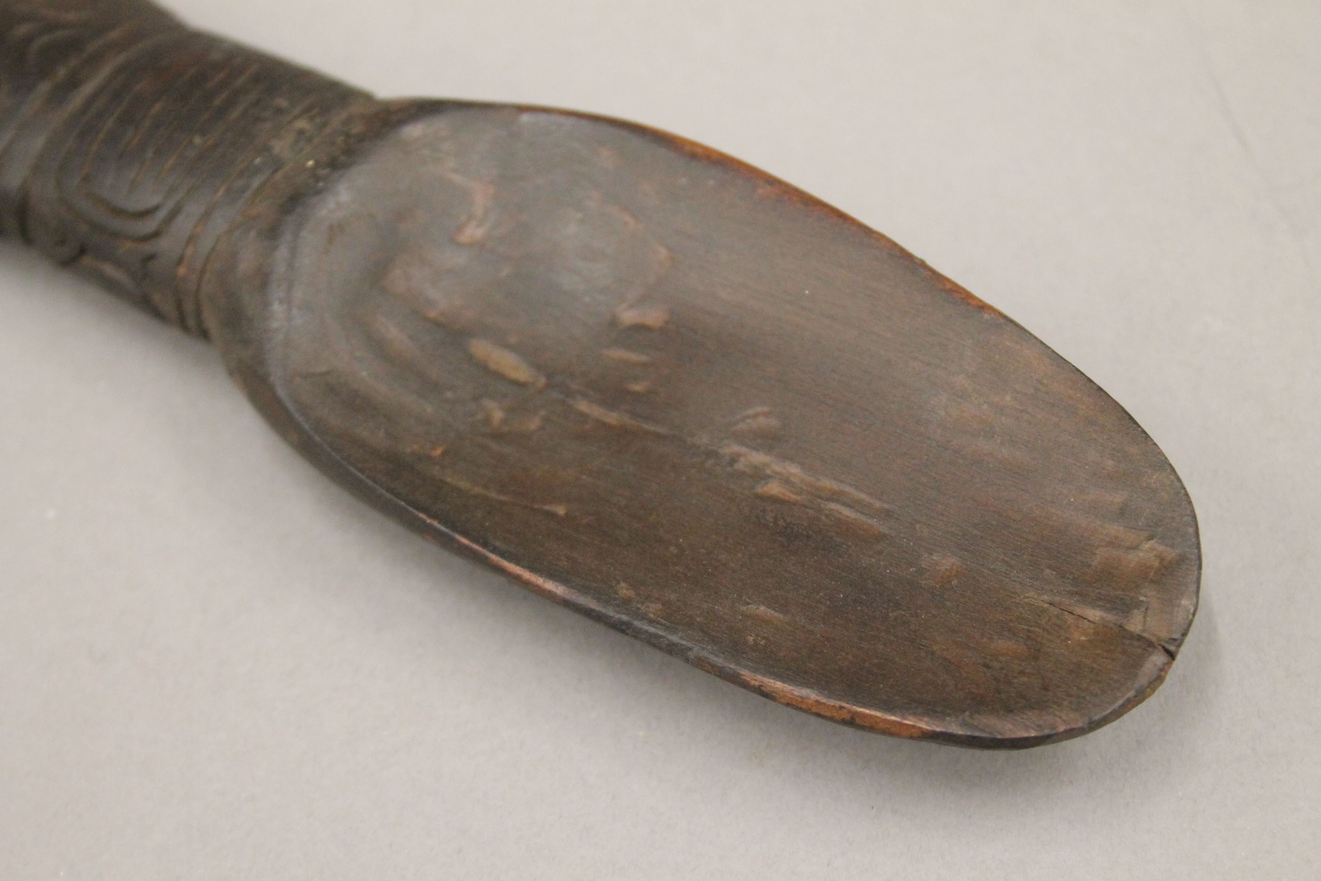 A South Seas carved wooden spoon. 23.5 cm long. - Image 3 of 3