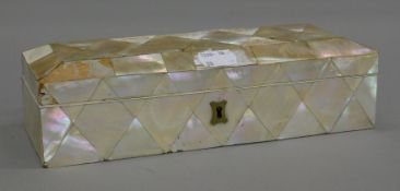 A 19th century mother-of-pearl box. 24 cm long.