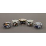 Five Japanese porcelain sake cups. The largest 3.5 cm high.