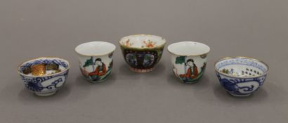 Five Japanese porcelain sake cups. The largest 3.5 cm high.