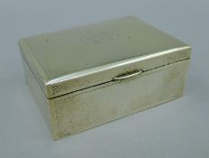 A small Chinese silver cigarette box with presentation inscription. 11.5 cm wide.