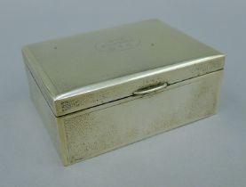 A small Chinese silver cigarette box with presentation inscription. 11.5 cm wide.