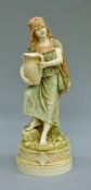 A 19th century Royal Dux porcelain figure of an Eastern maiden, pink triangle mark to base.
