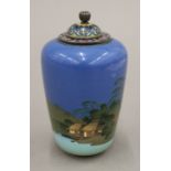 An early 20th century Japanese silver and cloisonne enamel lidded vase decorated with shoreline