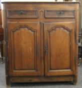 A 19th century Continental oak cupboard. 124 cm wide x 136 cm high.