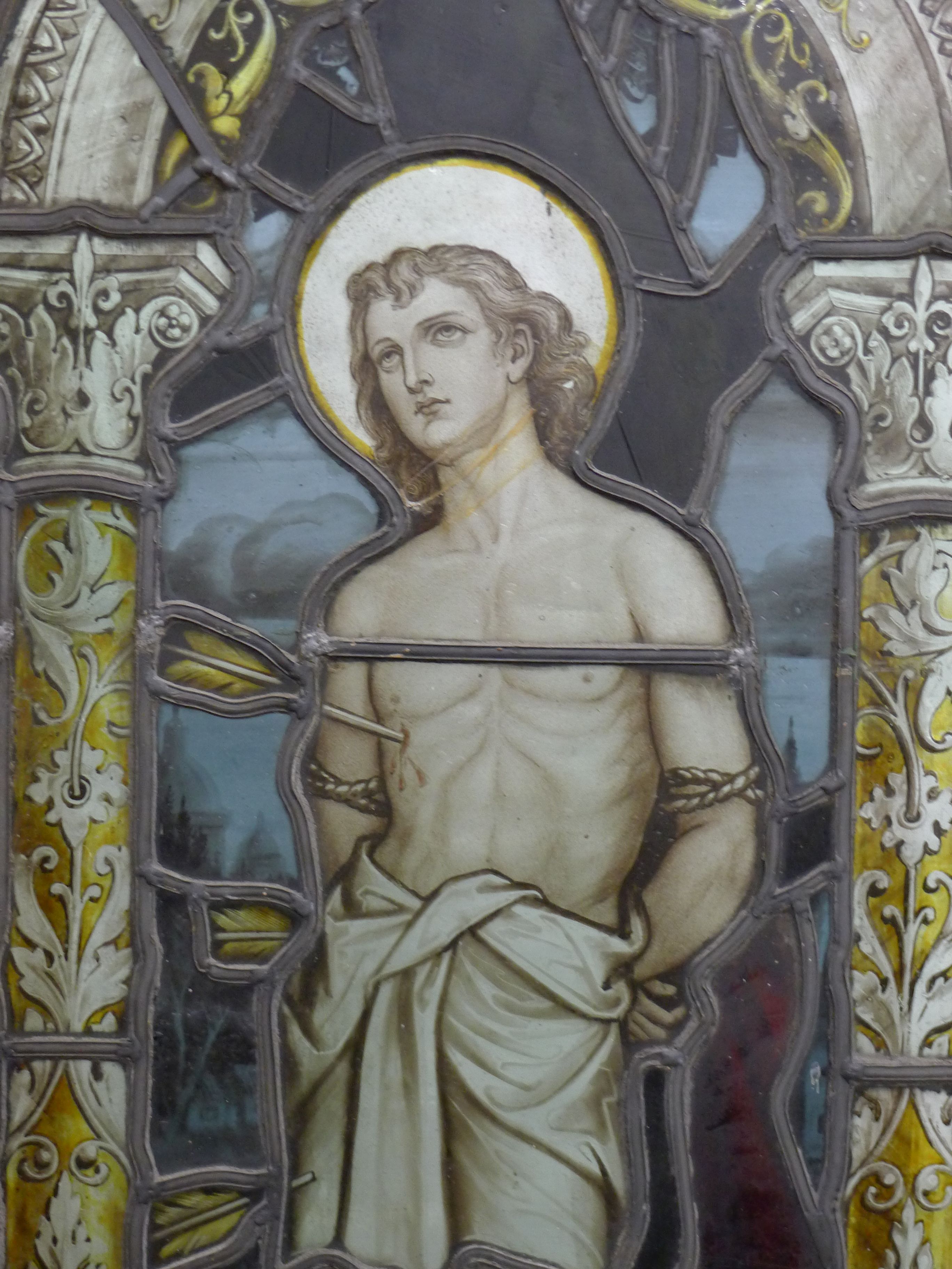 An antique stained leaded glass panel depicting the Martyrdom of Saint Sebastian, - Image 3 of 3