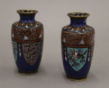 A pair of late 19th/early 20th century Japanese cloisonne vases decorated with dragons and phoenix,