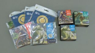 A quantity of Royal Mint Natural History Museum Dinosaur Collection coins.
