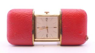 A vintage Oris purse watch in plush red travel case. 8 cm wide open.
