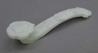 A white jade ruyi sceptre. 16 cm long.