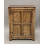 An 18th century panelled oak cupboard. 81.5 cm wide x 106 cm high.