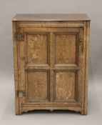 An 18th century panelled oak cupboard. 81.5 cm wide x 106 cm high.