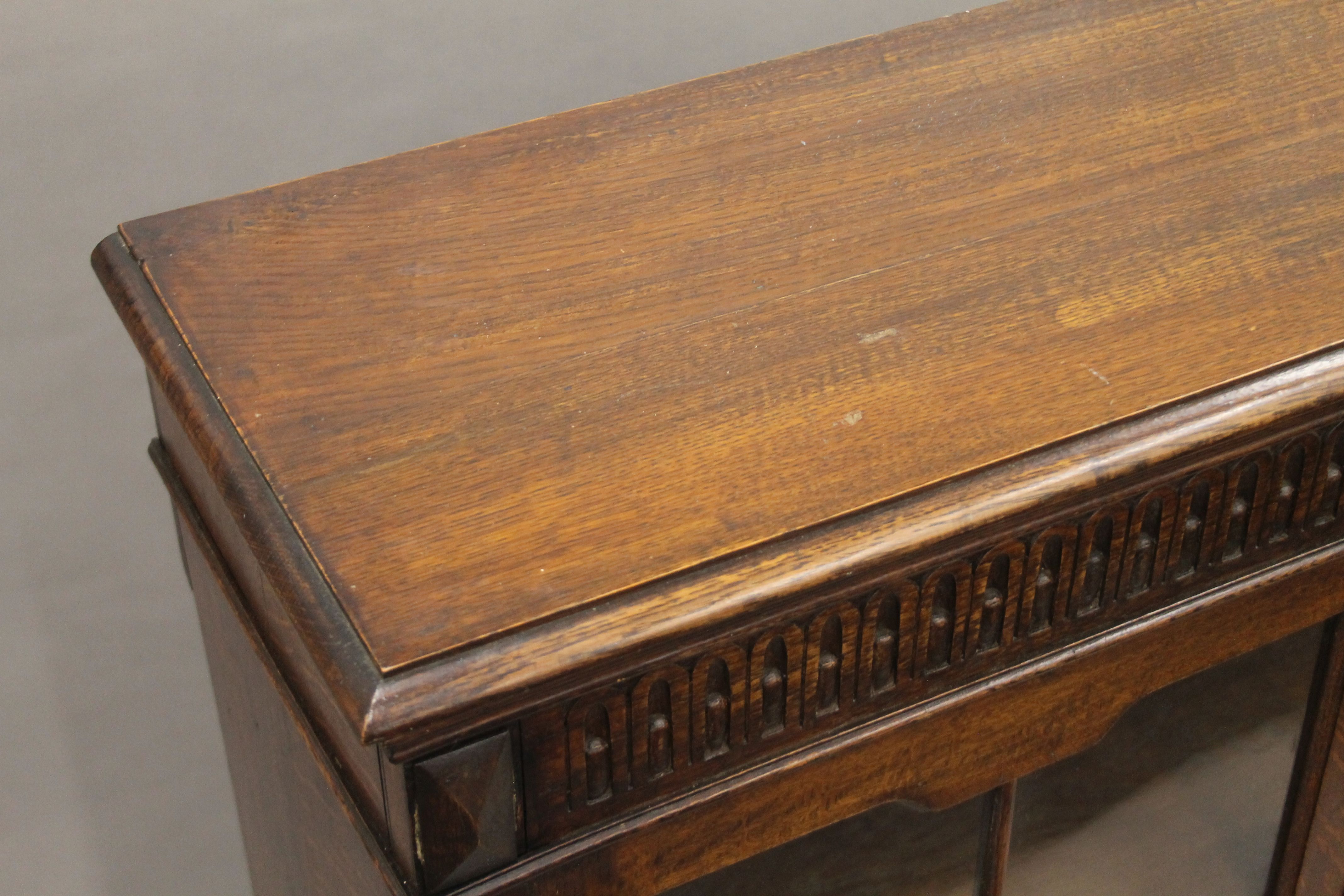 An early 20th century carved oak two door glazed barley twist cabinet. 105 cm wide. - Image 3 of 5