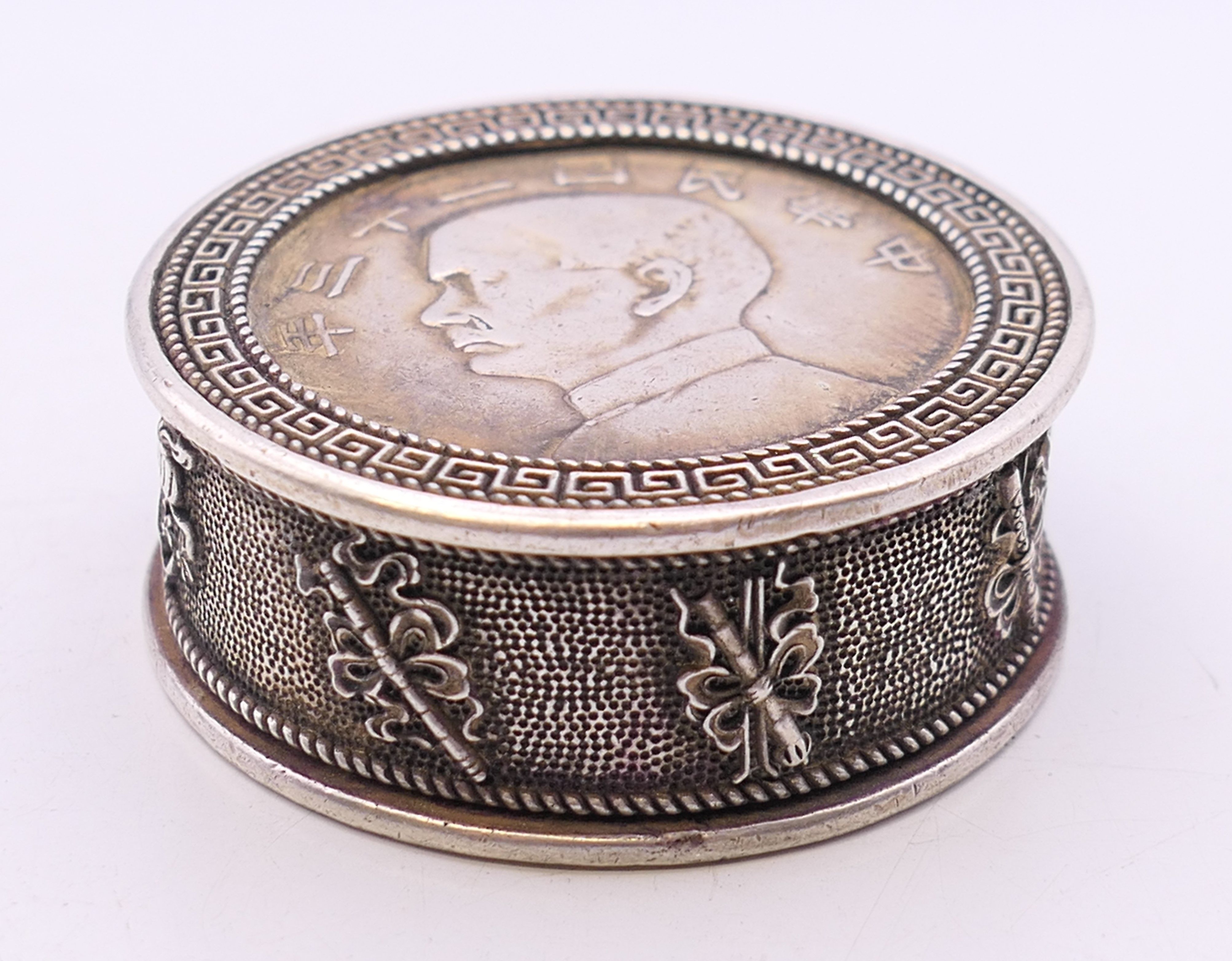 A Chinese coin box. 5 cm diameter.