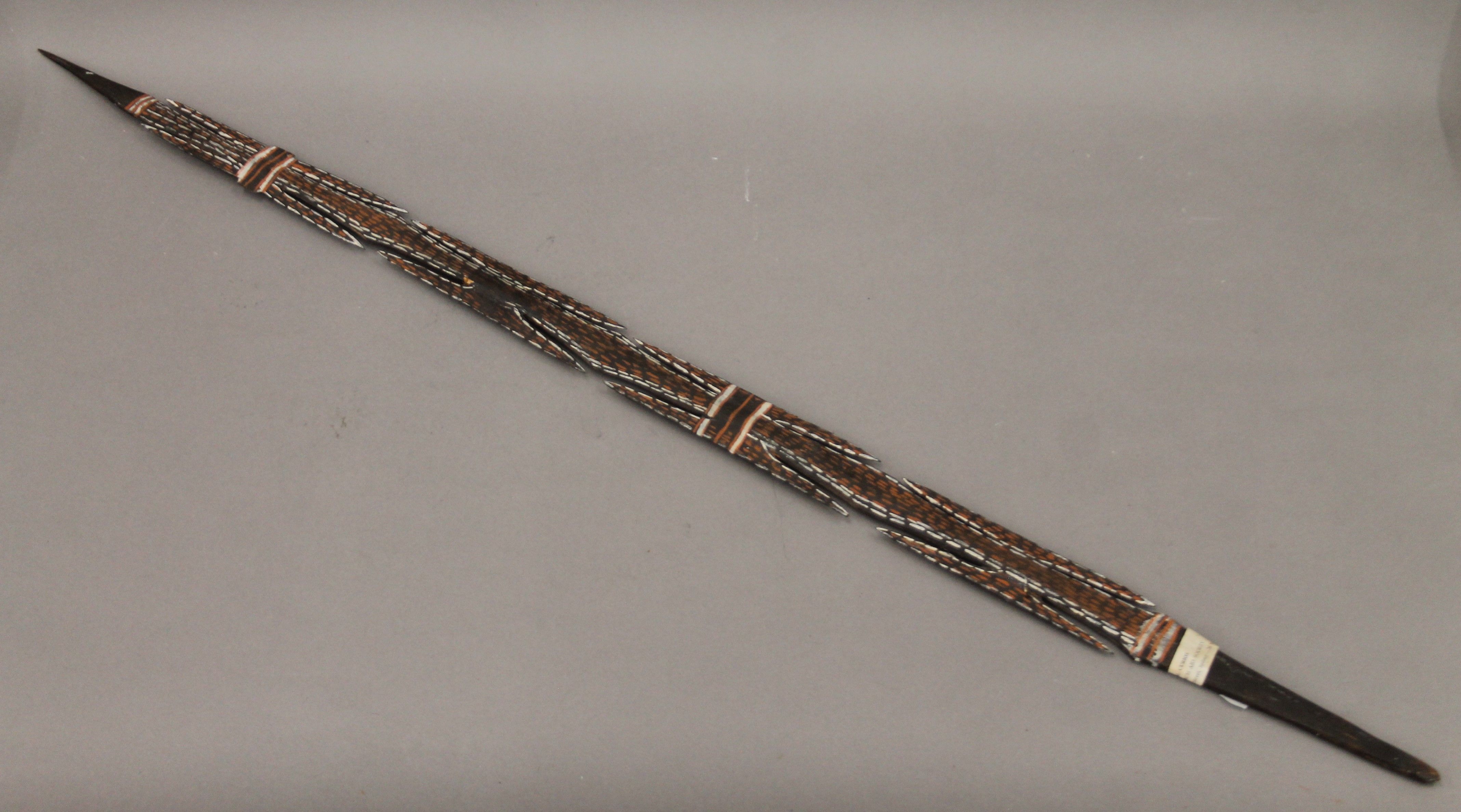 A painted Aboriginal spear. 105.5 cm long.