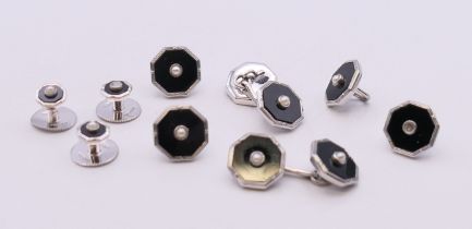 A set of 9 ct white gold dress buttons and studs, in a fitted case by Armour Winston Ltd,