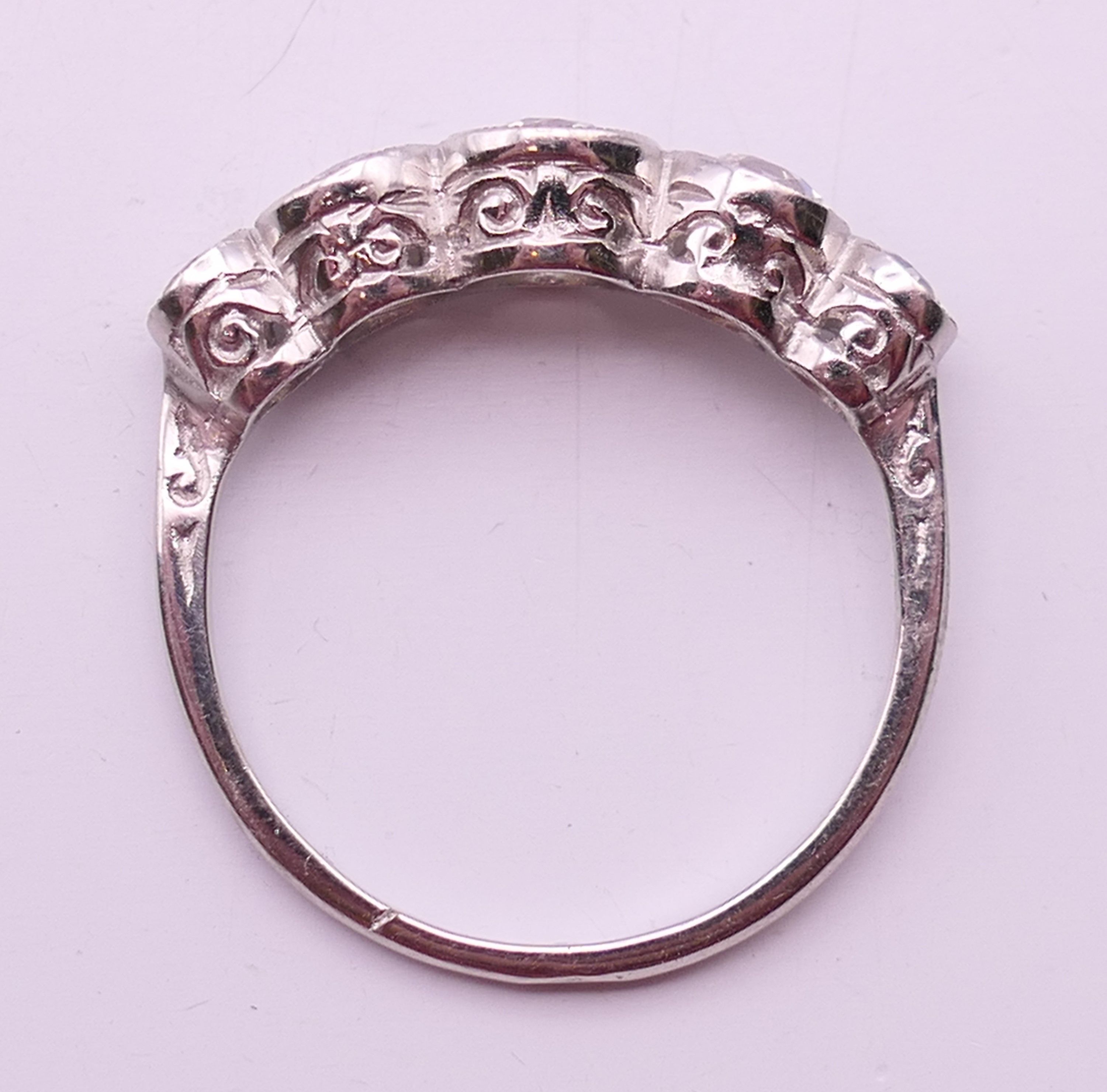 A platinum five stone diamond ring. Ring size N/O. - Image 6 of 6