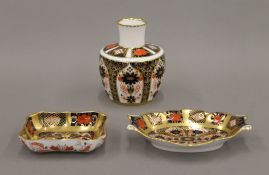Three pieces of Royal Crown Derby porcelain. The largest 10 cm high.