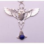 A sterling silver Egyptian Revival scarab beetle pendant on chain. The pendant 9.5 cm high.