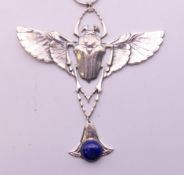 A sterling silver Egyptian Revival scarab beetle pendant on chain. The pendant 9.5 cm high.